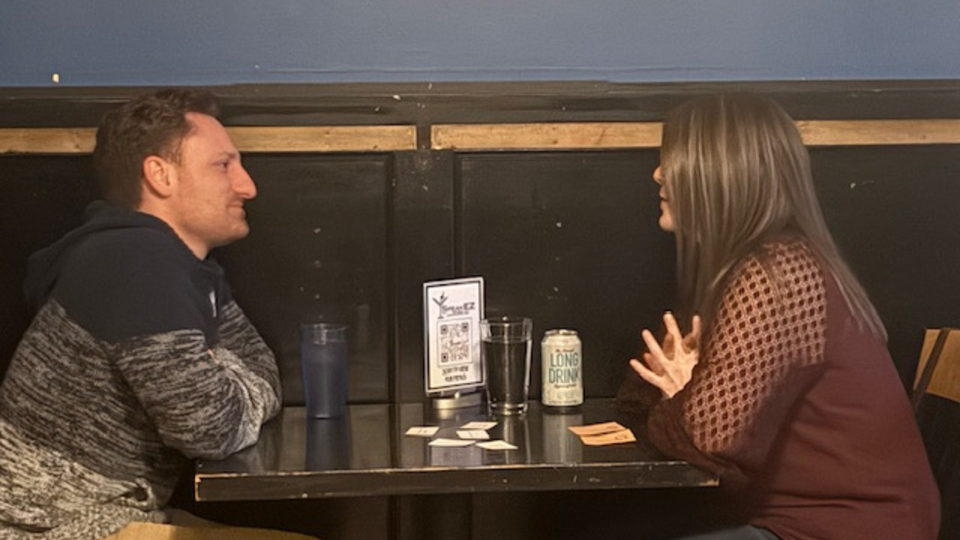 A Christian couple in their 20s-30s at a Christian Speed Dating event