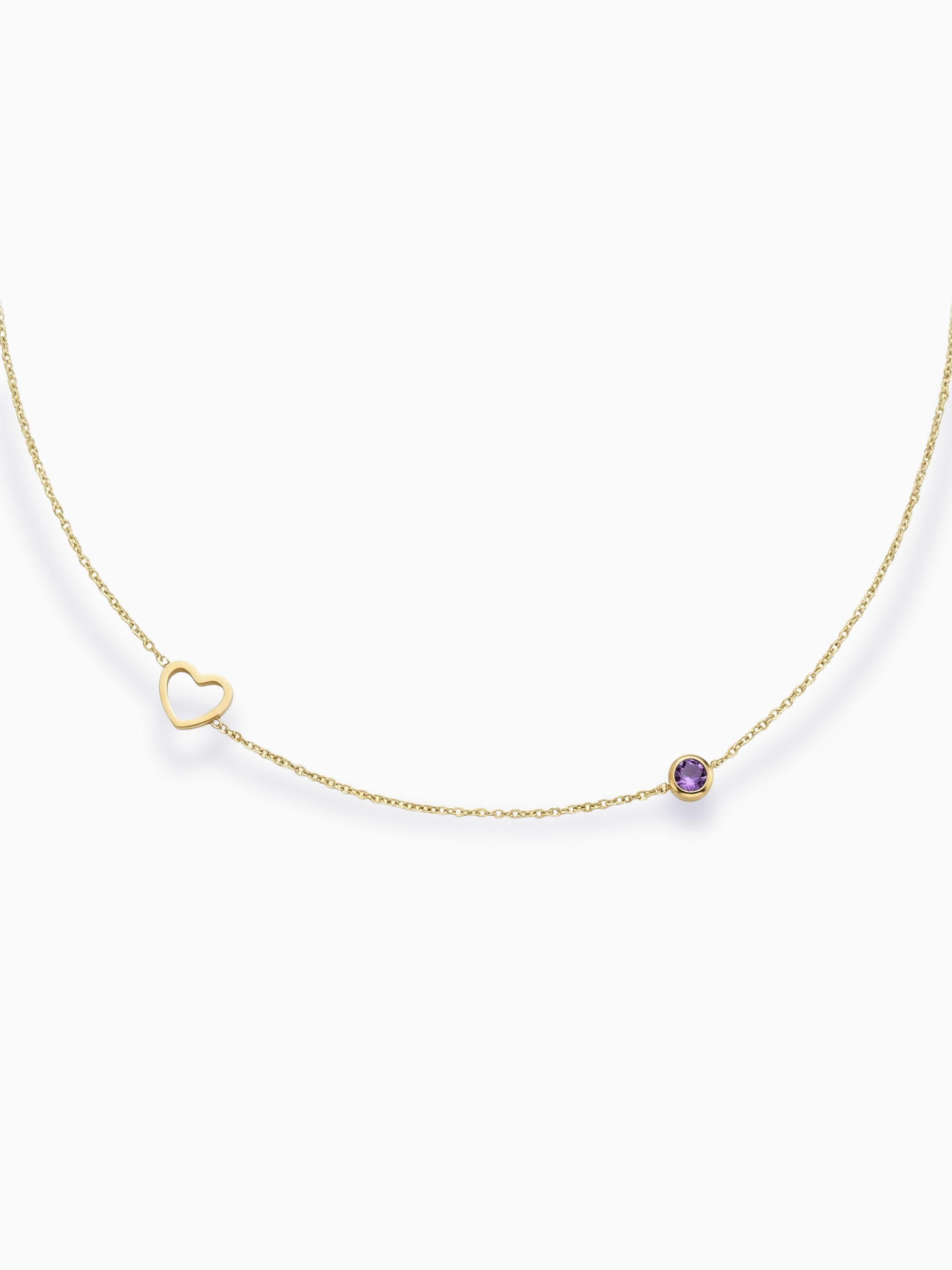 Goldene Ismara Halskette aus Edelstahl mit offenem Herz-Anhänger und lila Zirkon-Geburtsstein auf weißem Grund.