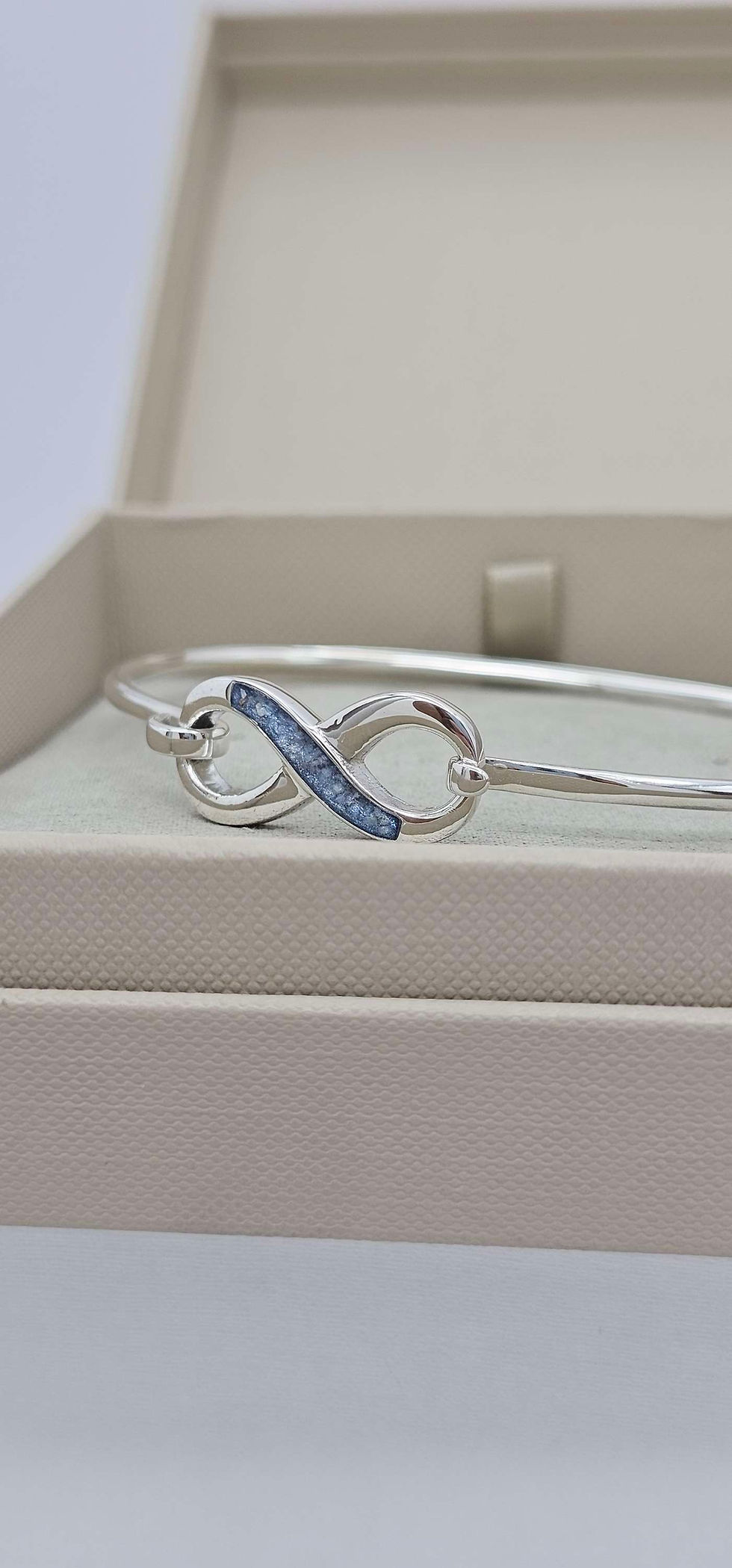 Thumbnail: Infinity bangle in sterling silver, suitable for cremation ashes, hair or for use as a memorial keepsake.