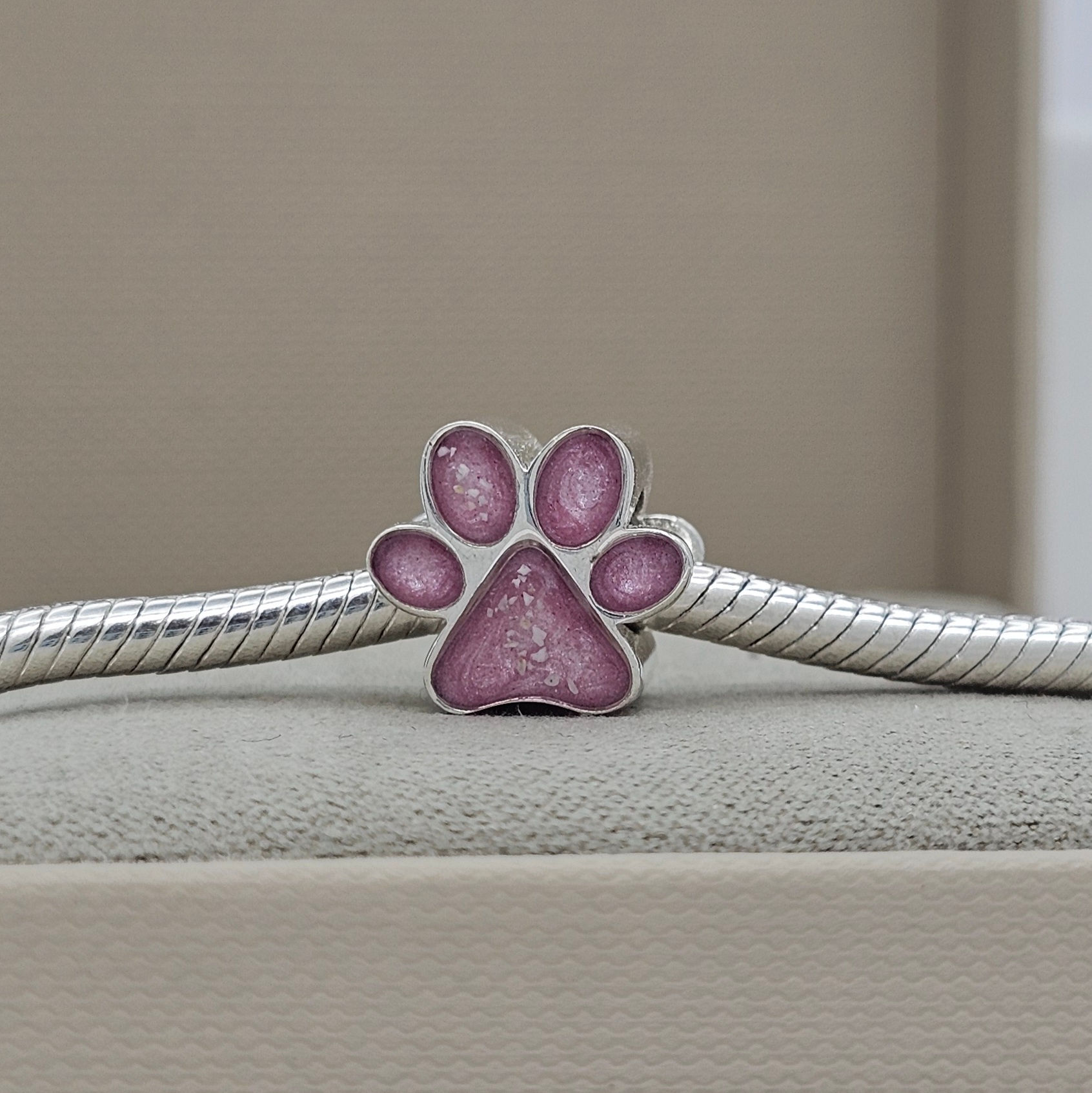 Silver pawprint memorial bracelet charm for cremation ashes and hair