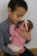 Child holding doll