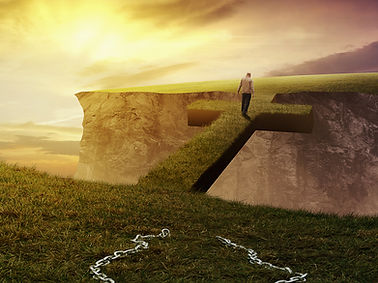a-man-breaks-from-his-chains-and-walks-on-a-bridge-SBI-301081192.jpg