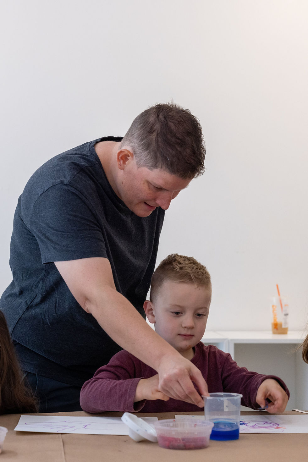 A parent and child painting together