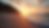 Eye-level view of a serene beach with a sunset