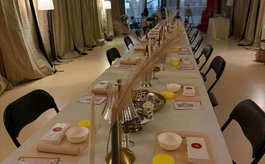 The ARTparty studio set with a long candlelit table