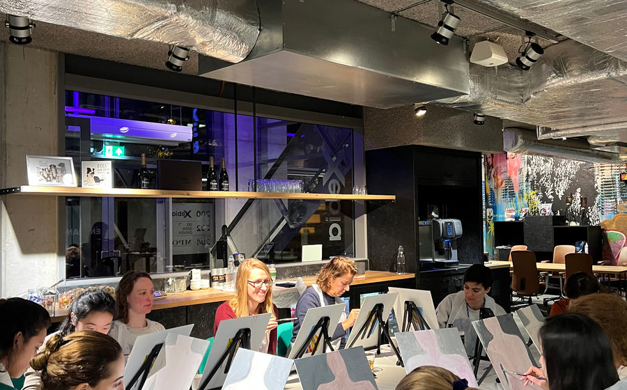 A team painting in their own office