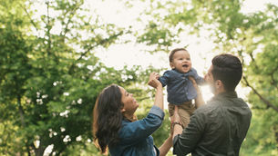 Family bonding with baby outside