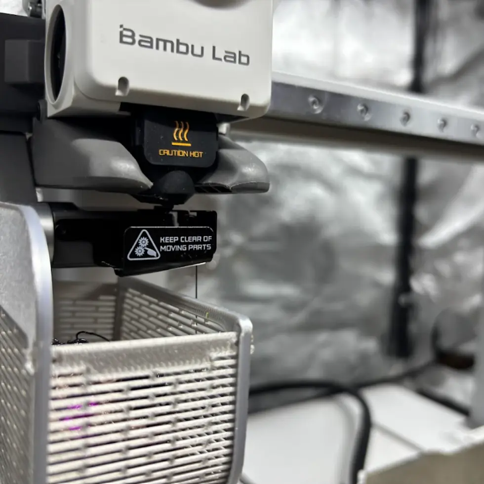 Bambu Lab A1 3D printer actively printing a custom project at Lagos Caceres Studio in Nashville, TN.