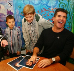 simon cowell with the children of Chase Childrens hospice