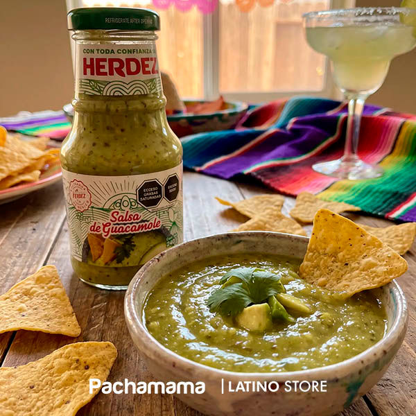 Herdez guacamole salsa served with tortilla chips in a Mexican home setting