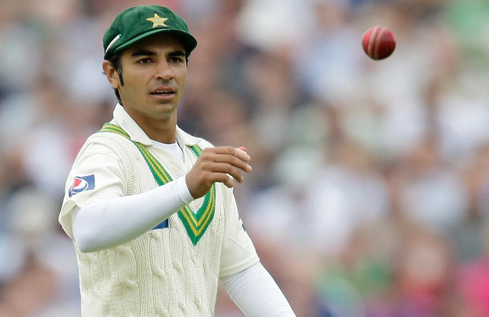 Salman Butt in white Test jersey gesturing during a match