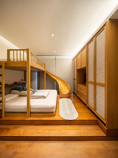 a bedroom with a bunk bed and a slide