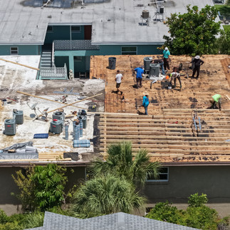Roofers from Spangler roofing re-roofing and doing a lift on a roof