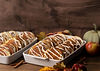 Keke's Breakfast Cafe catering tray of Cinnamon Roll Pancakes with sweet glaze and fresh sides