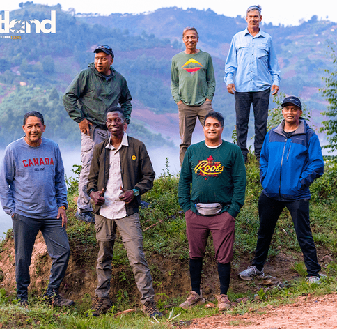 Gorilla trekking tour group standing together on hillside