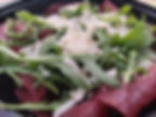 Piatto di bresaola, rucola e Grana