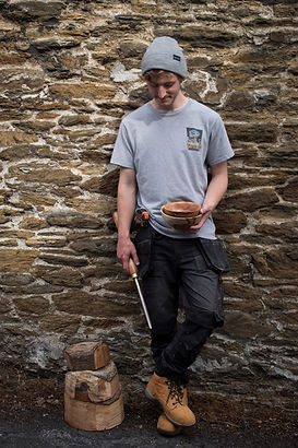 Henry Keate against a stone wall