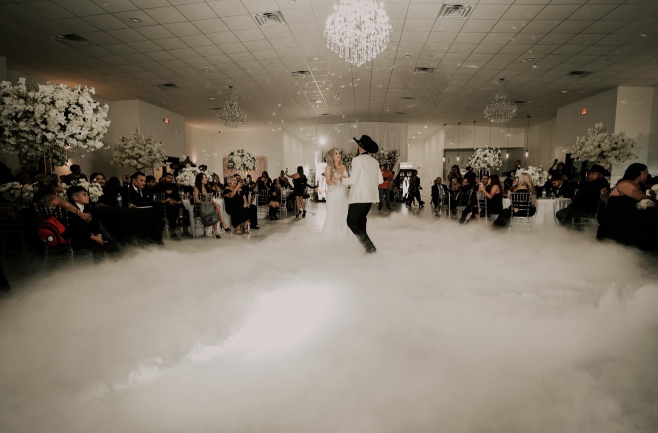 Budget-friendly Dallas wedding venue banquet space with decorated tables and reception lighting