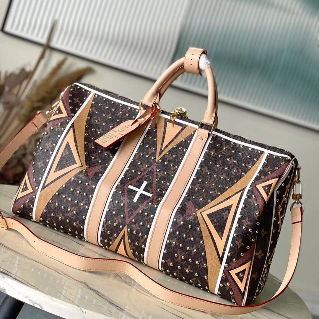 Louis Vuitton KEEPALL BANDOULIÈRE 50 IN PARFLECHE PATTERN MONOGRAM CANVAS