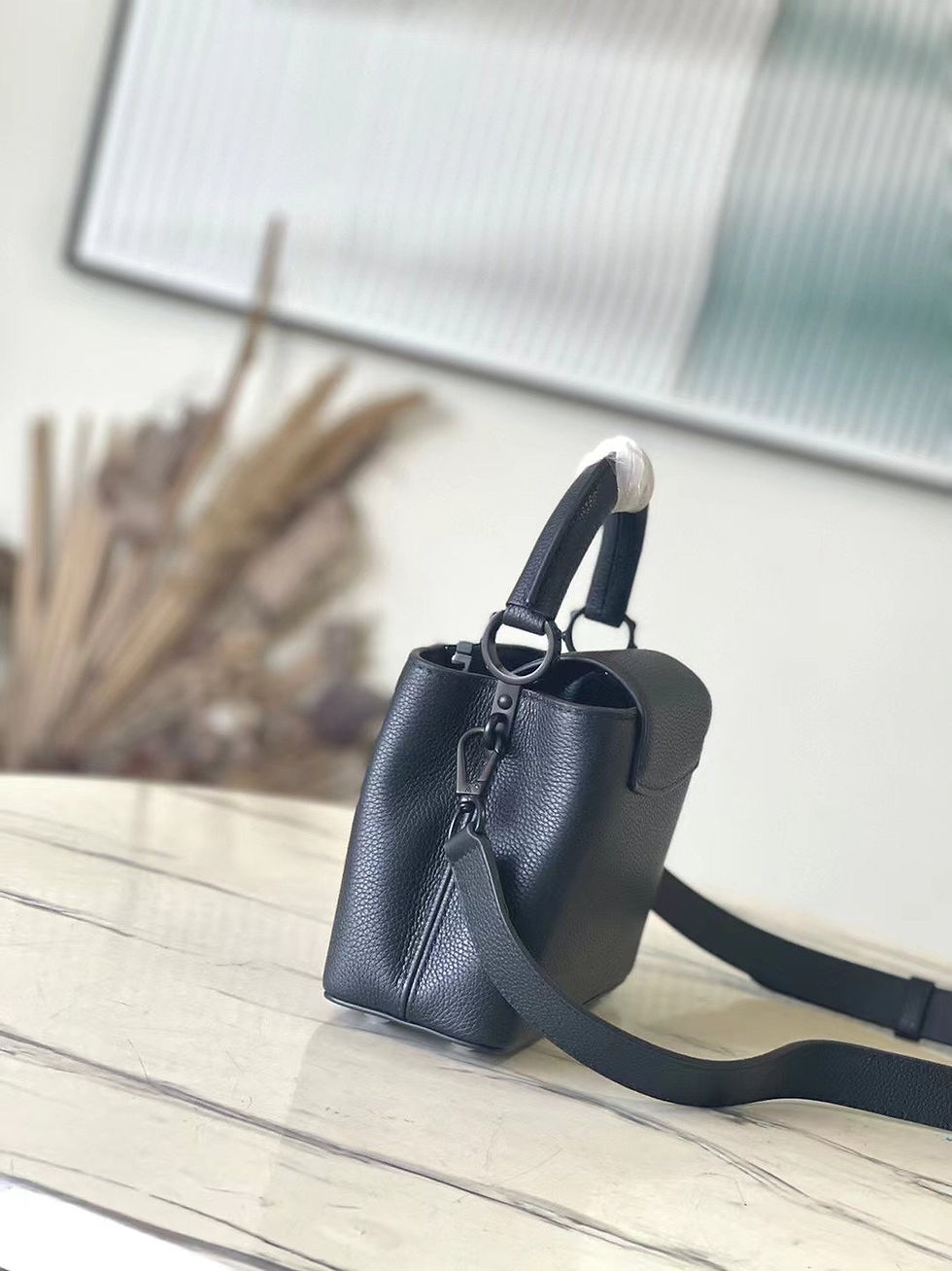 Thumbnail: Louis Vuitton CAPUCINES EAST-WEST MINI 21 IN BLACK TAURILLON