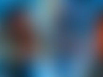 A woman uses a remote control and a smart phone