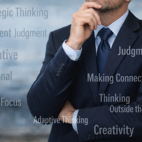 Man in business suit thinking with skills and strengths overlayed in semi-transparent text.