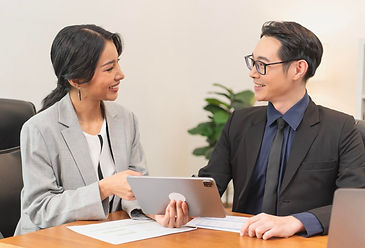 smiling-asian-businesswoman-showing-tablet-her-manager-meeting-office_74952-2763.jpg