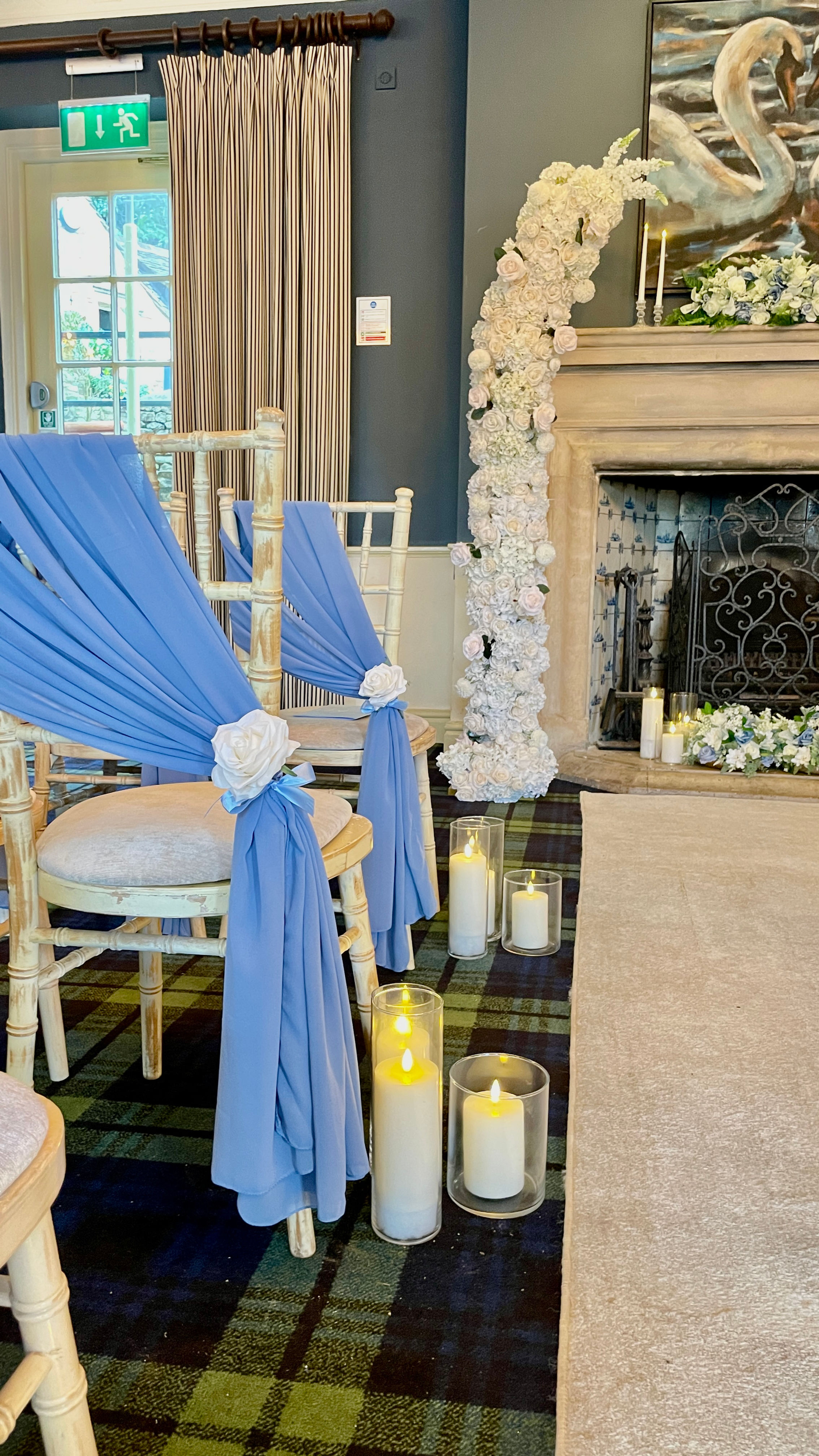 Single chiffon drape dressed with a silk flower & faux foliage