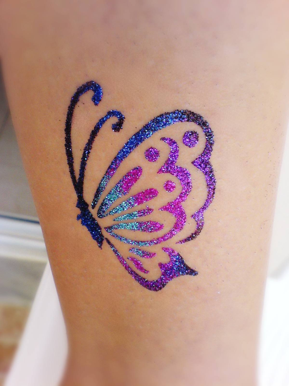 Butterfly glitter tattoo in Los Angeles