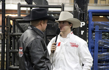 Screenshot of article "1,000 Tibetans" with an image of a Tibetan refugee sitting on a rock near a river in Calgary, Alberta.