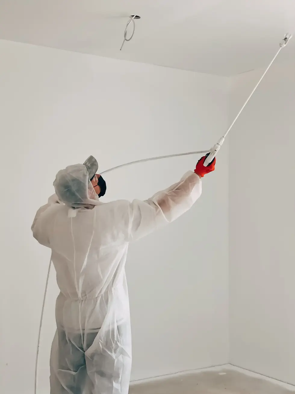 man-paints-ceiling-with-a-paint-sprayer-2026-03-16-05-03-03-utc copy.webp