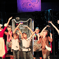 Youth theatre production cast performing "Peter Pan"