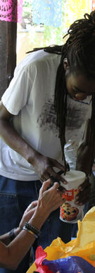 People making candles together outdoors