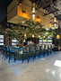 Monumental tree installation with hanging lights inside Blake's Oyster Bar in Cascade.