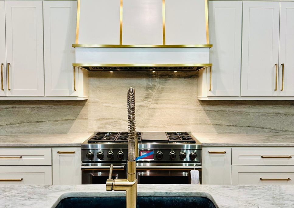 Custom cabinetry and brass detailing at Briarcliff Manor, view 2.