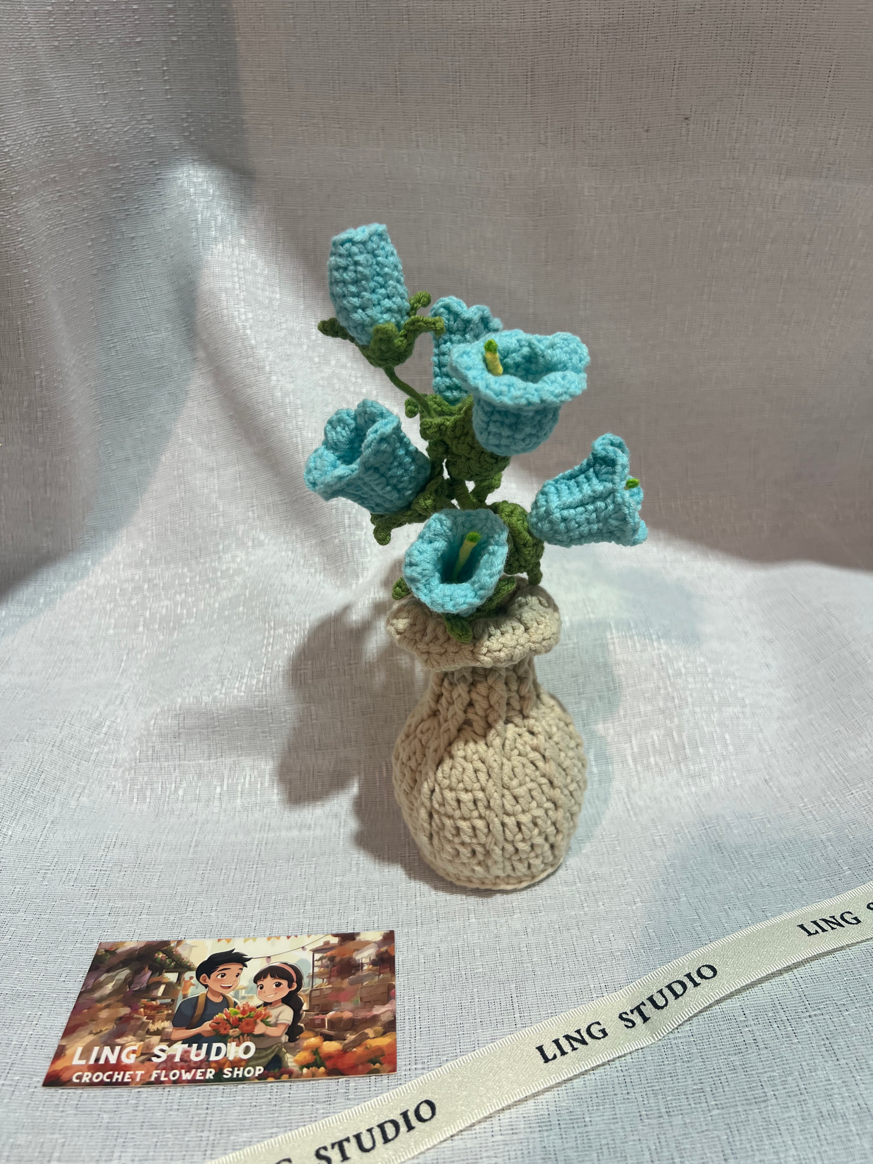 Crocheted Blue Flower Arrangement in a Beige Vase