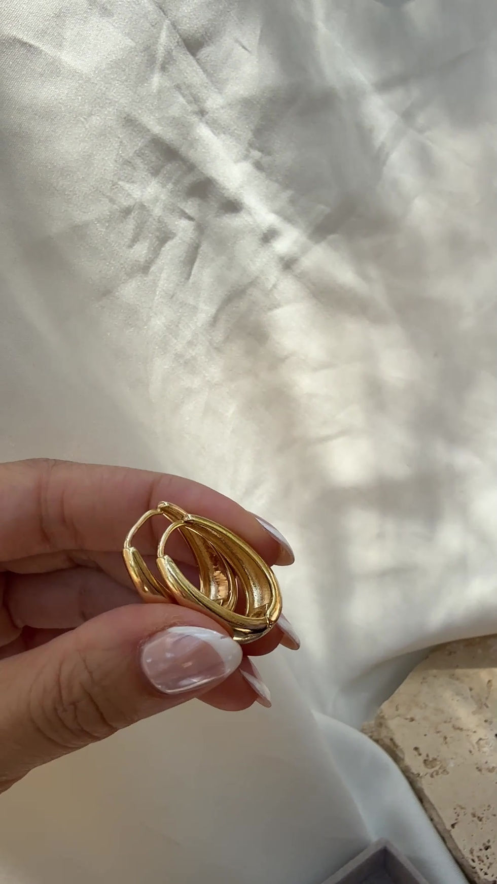 Thumbnail: Gold Oval Huggie Earrings