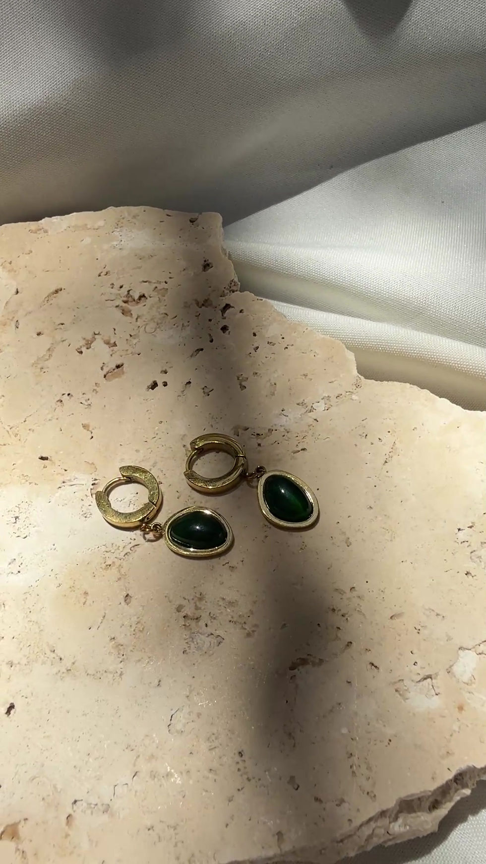 Thumbnail: Gold Huggie Earrings with Green Ovoid Gemstone Charms