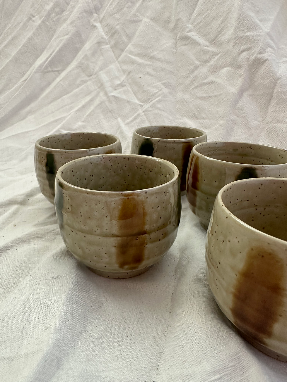 Thumbnail: Set of 5 Japanese Handcrafted Stoneware Sake Cups, Irregular Rust/Khaki Stripe