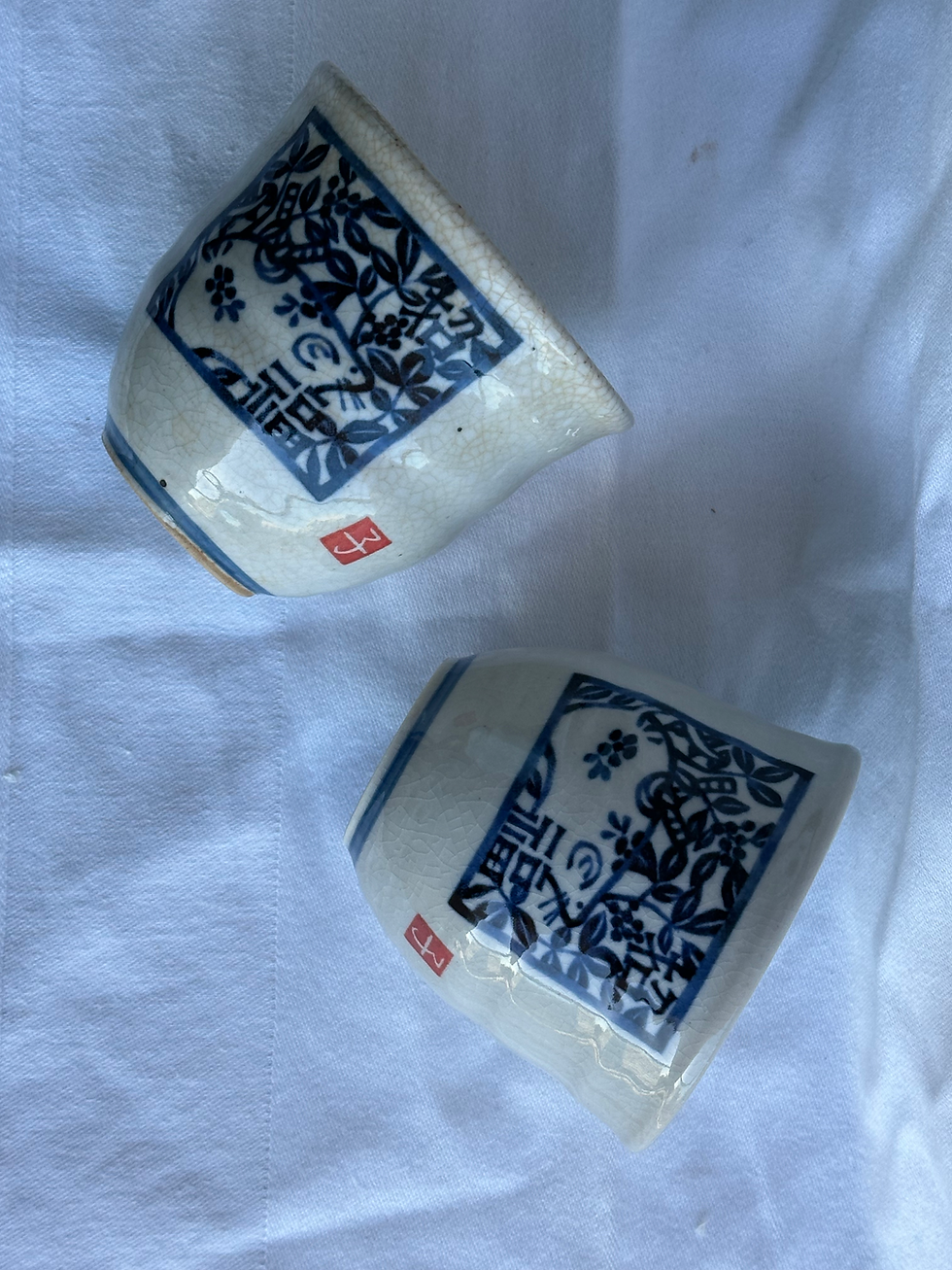 Thumbnail: Pair of Chinese Zodiac Porcelain Tea Cups, Crazed Cream/Blue Design (Mouse)