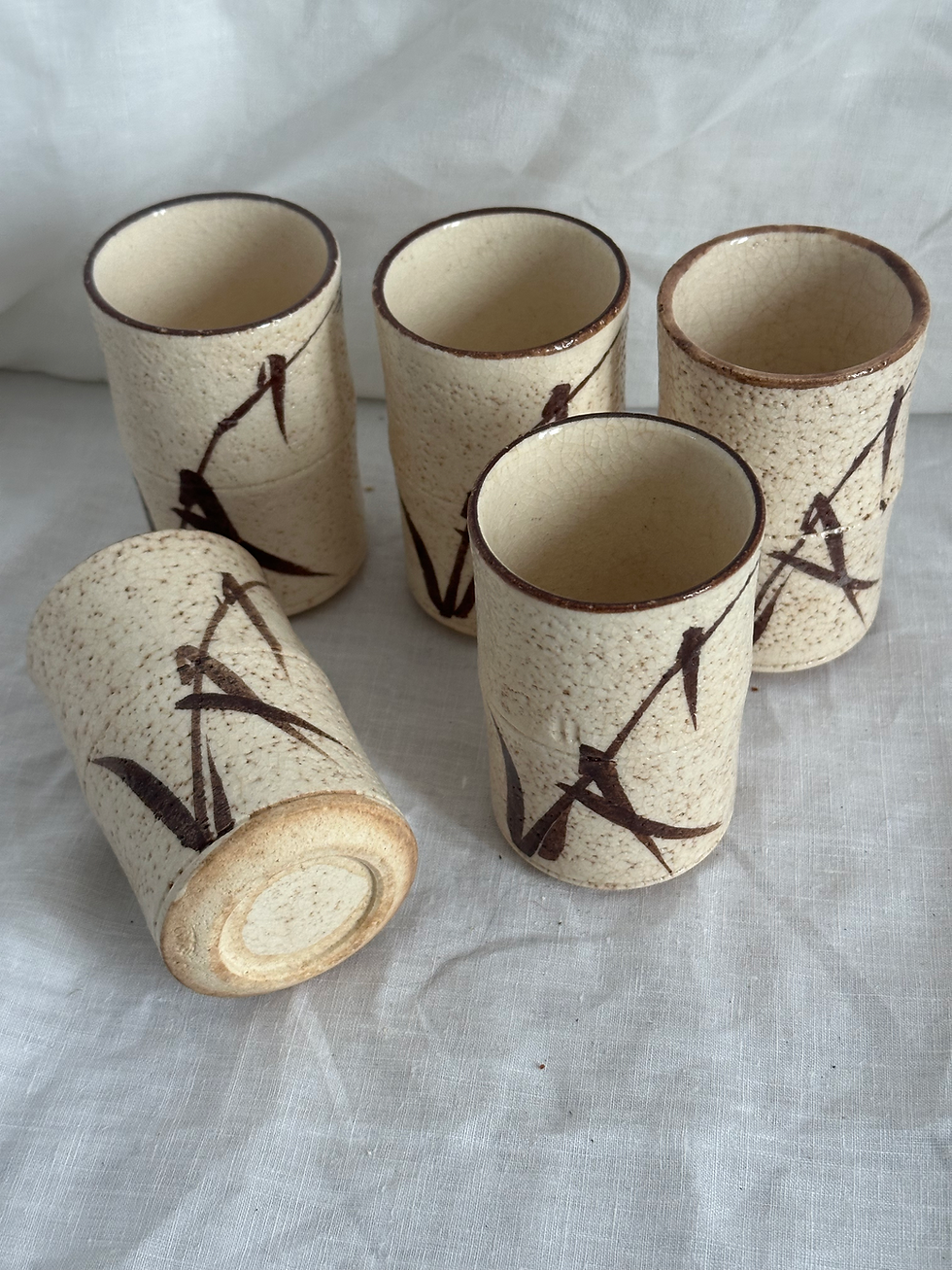 Thumbnail: Set of 5 Japanese Seto ware Yunomi Tea Cups, Cream Shino Glaze/Brown Bamboo Leaf