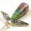 Thumbnail: Green, blue, and purple paper bead angel ornament laying diagonally, head first, on a white background.