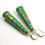 Thumbnail: Green, blue, coral, and gold speckled paper bead earrings on a white background.