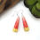 Thumbnail: Pink ombre and gold paper bead earrings on a white background.