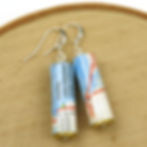 Thumbnail: Maui, Hawaii map earrings on a wood background.