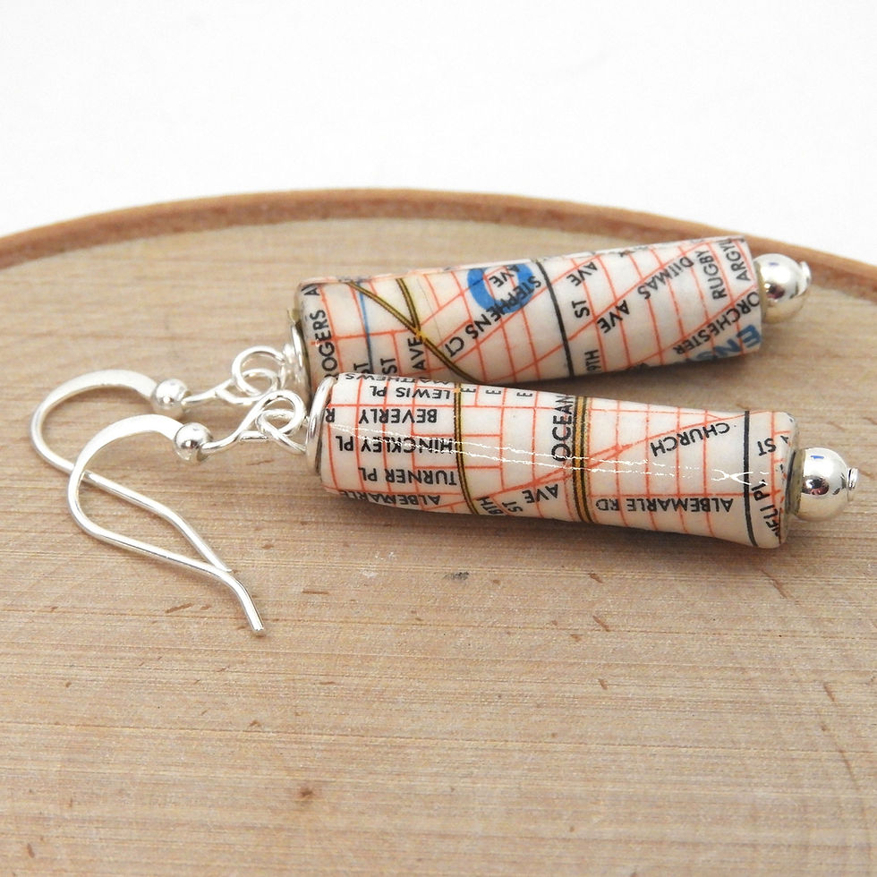Thumbnail: Upcycled Brooklyn, NY map earrings on a wood background.