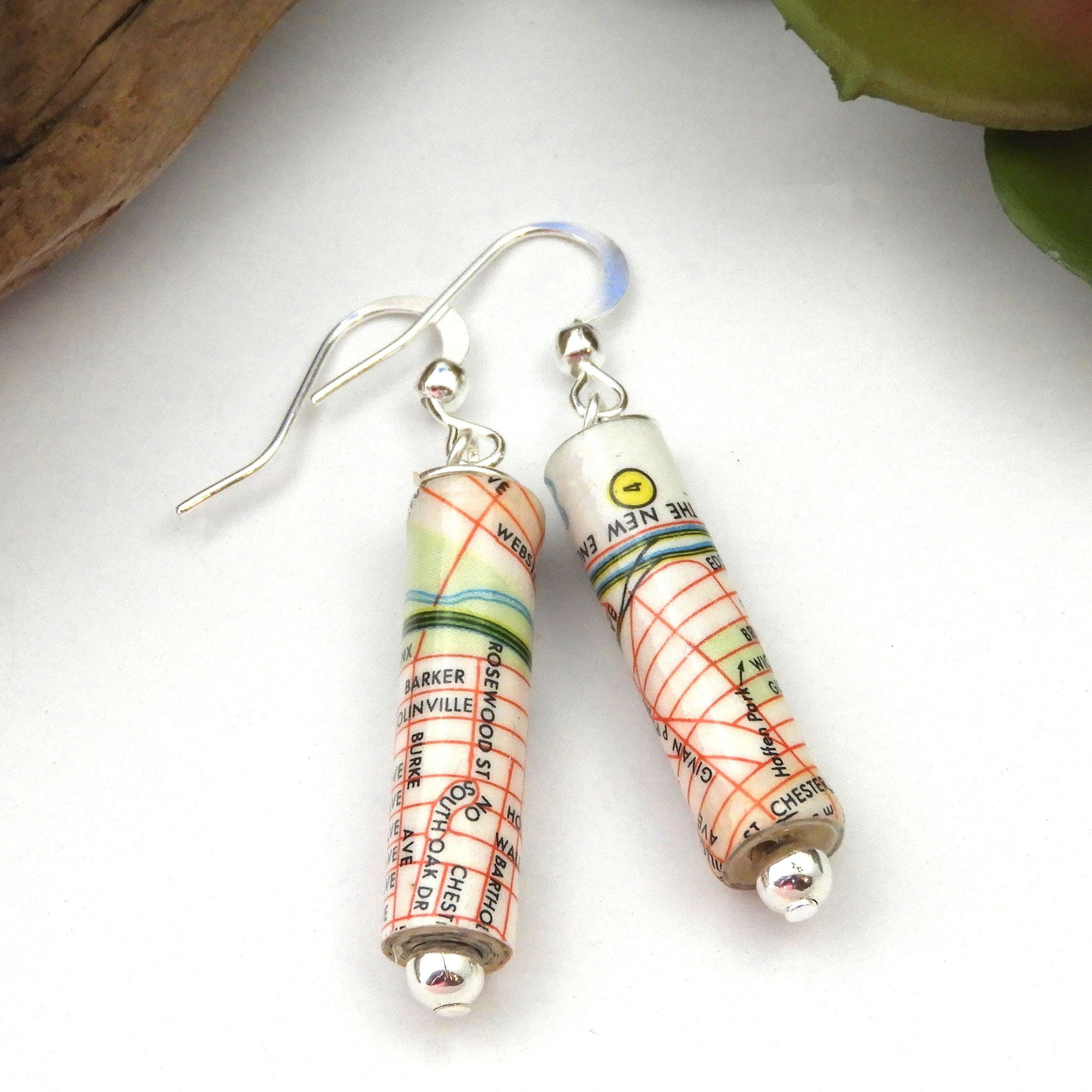Upcycled Bronx, NY map earrings on a white background.