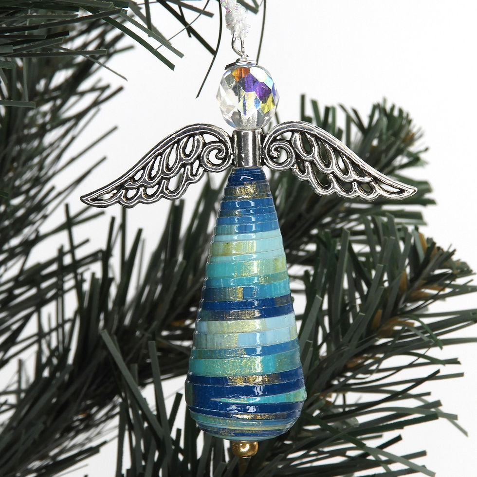 Thumbnail: Shades of blue striped paper bead angel ornament hanging from a Christmas tree.