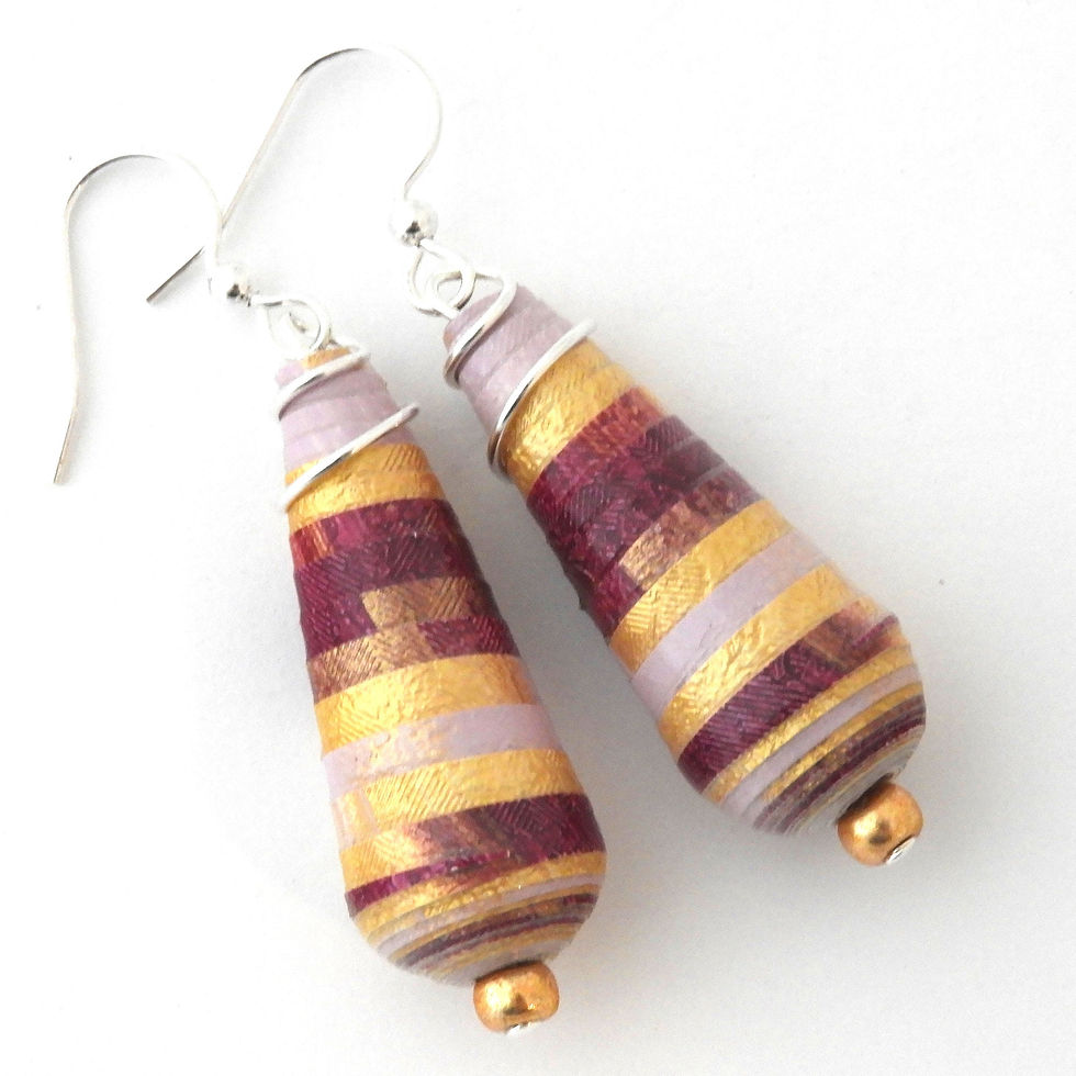 Magenta, lilac, and gold striped paper bead earrings on a white background.