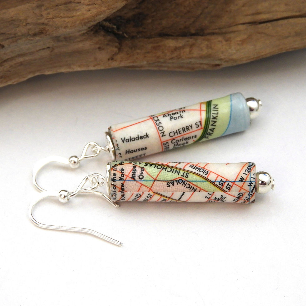 Upcycled Manhattan map earrings on a white background,